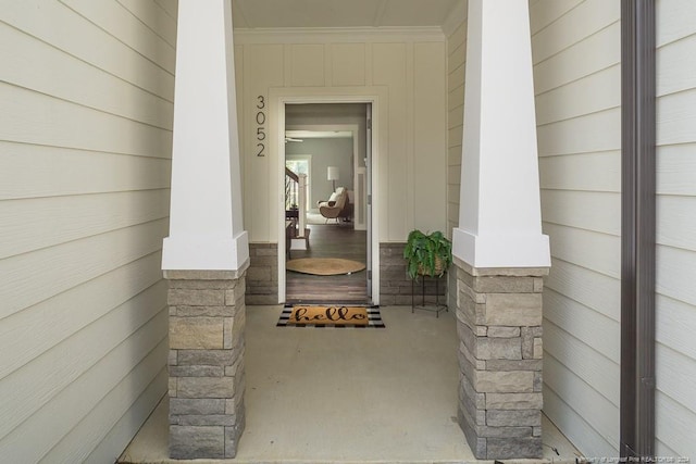 property entrance with stone siding