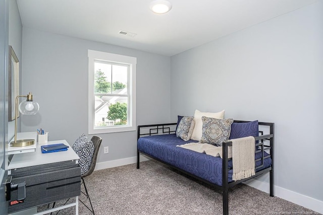 bedroom featuring baseboards, visible vents, and carpet