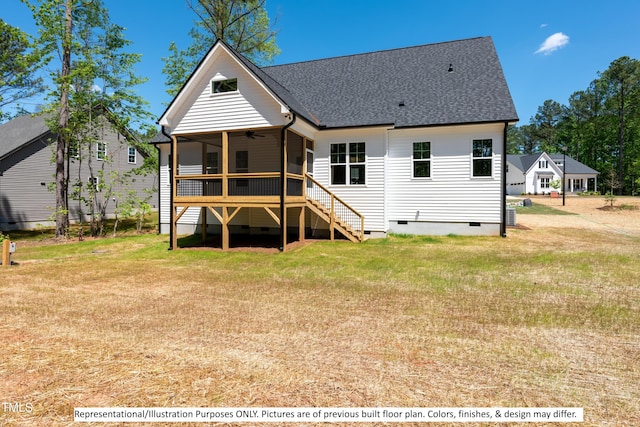 rear view of house with a yard