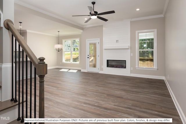 unfurnished living room featuring hardwood / wood-style flooring, crown molding, and plenty of natural light