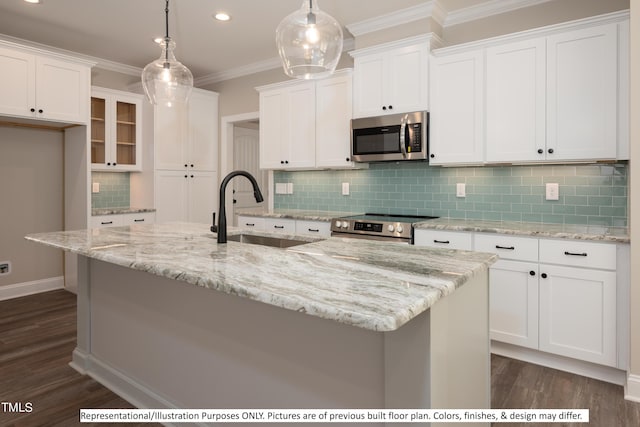 kitchen featuring white cabinets, appliances with stainless steel finishes, hanging light fixtures, and sink