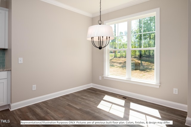 unfurnished dining area featuring dark hardwood / wood-style floors and crown molding