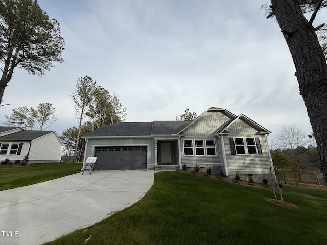 view of front of home featuring a garage and a front yard