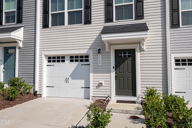 doorway to property featuring a garage