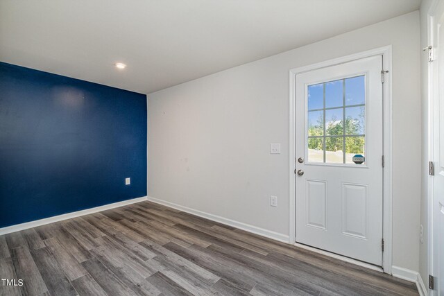 doorway to outside featuring dark hardwood / wood-style flooring