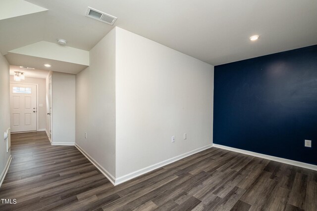 unfurnished room featuring dark hardwood / wood-style floors