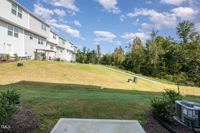 view of yard featuring central air condition unit