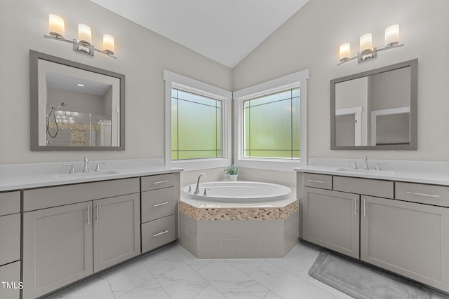 bathroom with vanity and vaulted ceiling