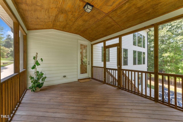 unfurnished sunroom with wooden ceiling and lofted ceiling