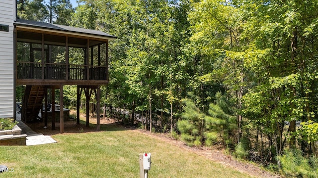 view of yard featuring a sunroom