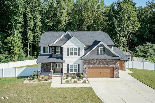 159 Shady Oaks Dr, Benson, NC 27504 - craftsman house with a front yard, covered porch, stone siding, concrete driveway, and fence