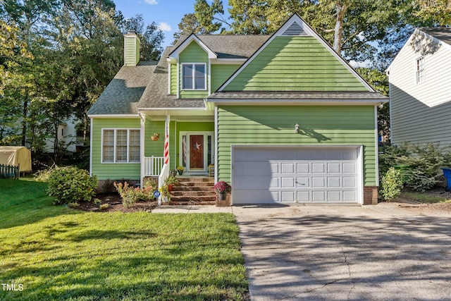 view of front of house featuring a garage and a front yard