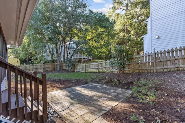 wooden deck with a patio area