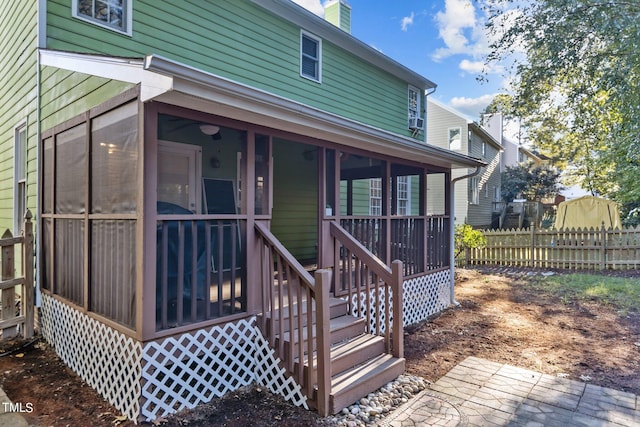 exterior space featuring a sunroom