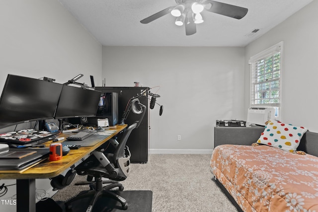 carpeted bedroom featuring cooling unit, a textured ceiling, and ceiling fan