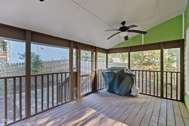 sunroom featuring vaulted ceiling and ceiling fan