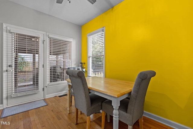 dining area featuring ceiling fan, hardwood / wood-style flooring, and a wealth of natural light