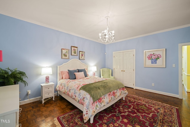 bedroom featuring ornamental molding, a closet, dark parquet flooring, and a notable chandelier