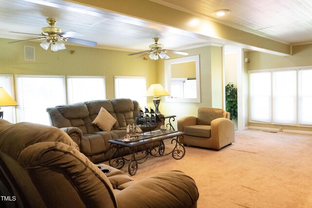 carpeted living room featuring ceiling fan and ornamental molding