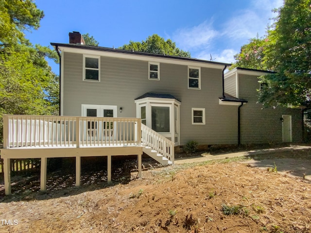 rear view of house with a wooden deck