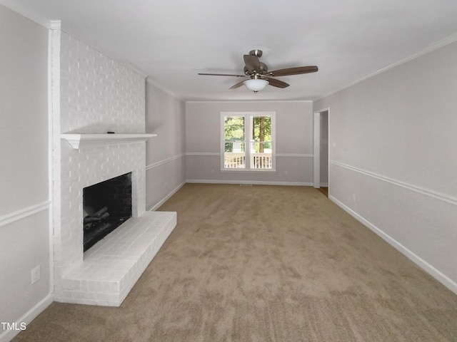 unfurnished living room featuring light carpet, a fireplace, and ceiling fan