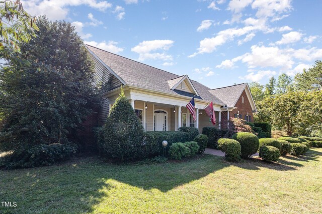 view of front of house featuring a front lawn and a porch