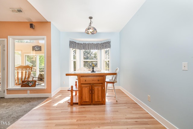 dining room with light hardwood / wood-style flooring