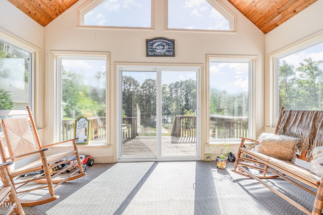 sunroom featuring a wealth of natural light, wooden ceiling, and lofted ceiling