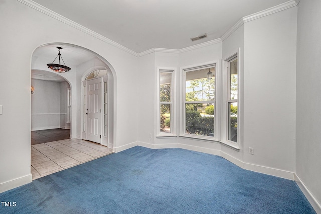 3313 Overhead Ct, Willow Springs, NC 27592 - unfurnished room featuring arched walkways, carpet, ornamental molding, and tile patterned floors
