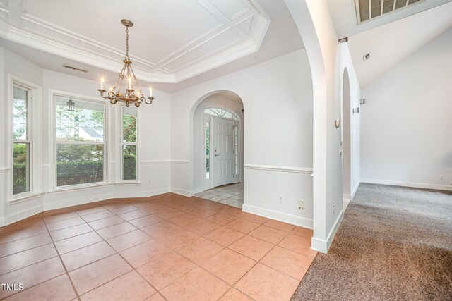 3313 Overhead Ct, Willow Springs, NC 27592 - unfurnished room featuring arched walkways, light tile patterned floors, a chandelier, a raised ceiling, and ornamental molding