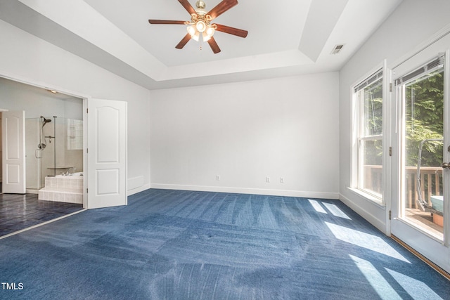 3313 Overhead Ct, Willow Springs, NC 27592 - unfurnished bedroom featuring access to exterior, a raised ceiling, dark carpet, and connected bathroom