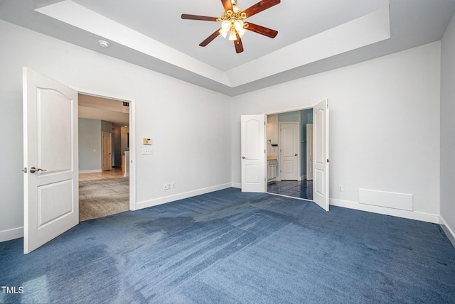 3313 Overhead Ct, Willow Springs, NC 27592 - unfurnished bedroom featuring carpet, a raised ceiling, and a ceiling fan
