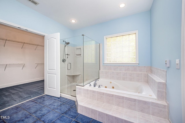 3313 Overhead Ct, Willow Springs, NC 27592 - bathroom with a shower stall, a whirlpool tub, tile patterned flooring, a spacious closet, and recessed lighting