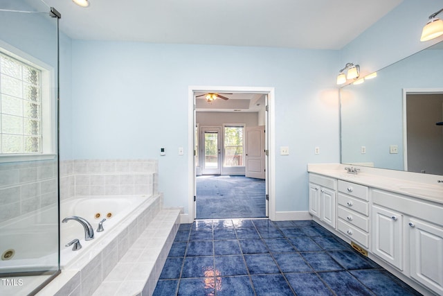 3313 Overhead Ct, Willow Springs, NC 27592 - bathroom with double vanity, a tub with jets, and ceiling fan