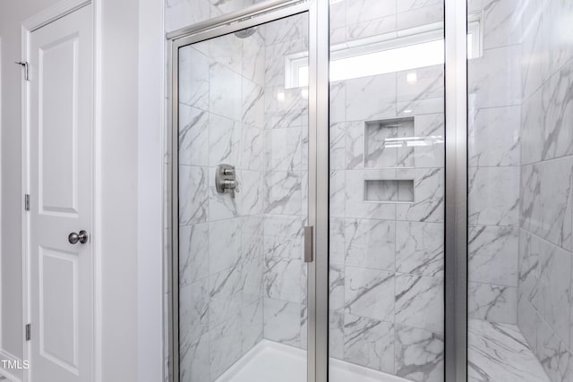 bathroom featuring a shower stall