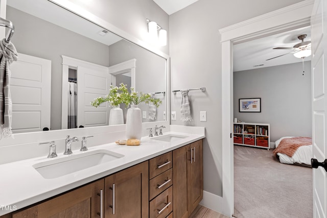 bathroom with ceiling fan and vanity