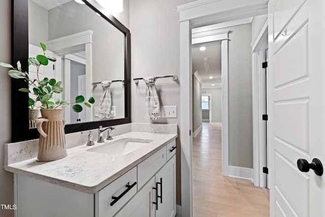 bathroom with vanity and hardwood / wood-style floors