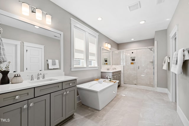 bathroom featuring vanity and plus walk in shower