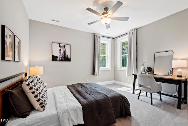 bedroom featuring ceiling fan and light colored carpet