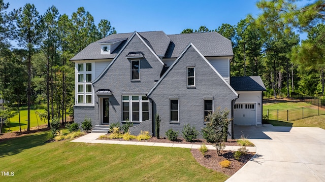 view of front facade with a front lawn and a garage