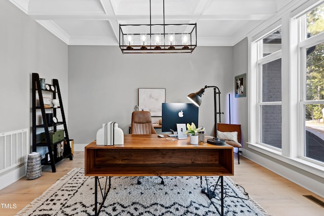 office featuring beamed ceiling, light hardwood / wood-style flooring, coffered ceiling, a notable chandelier, and crown molding