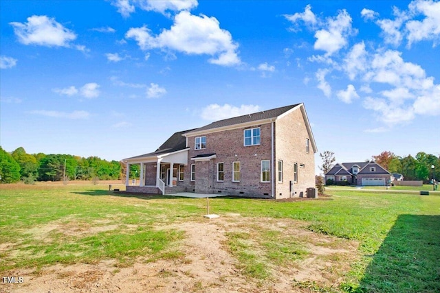46 Otter Hole Dr, Kenly, NC 27542 - rear view of house with covered porch, brick siding, crawl space, central air condition unit, and a yard