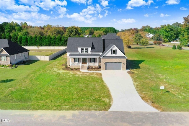 46 Otter Hole Dr, Kenly, NC 27542 - modern inspired farmhouse with a garage, fence, covered porch, a front yard, and driveway