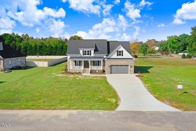 46 Otter Hole Dr, Kenly, NC 27542 - view of front facade featuring fence, covered porch, concrete driveway, and a front lawn