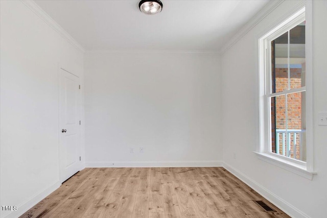 46 Otter Hole Dr, Kenly, NC 27542 - unfurnished room with crown molding, visible vents, and light wood-style flooring