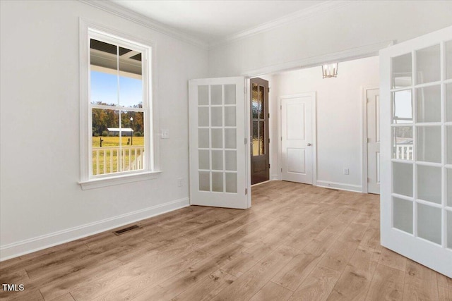 46 Otter Hole Dr, Kenly, NC 27542 - unfurnished room with baseboards, visible vents, ornamental molding, and light wood-style flooring