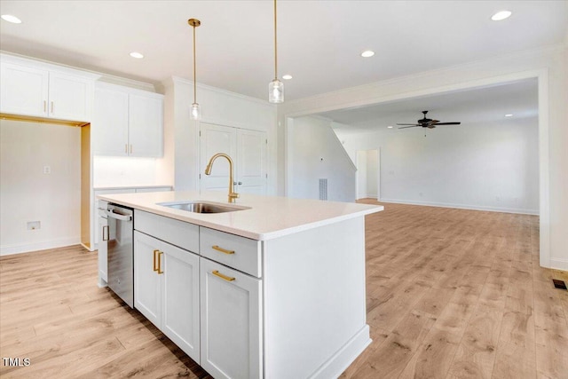 46 Otter Hole Dr, Kenly, NC 27542 - kitchen with ceiling fan, stainless steel dishwasher, a center island with sink, light wood-type flooring, and a sink