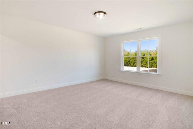 46 Otter Hole Dr, Kenly, NC 27542 - unfurnished room featuring baseboards, visible vents, and light carpet