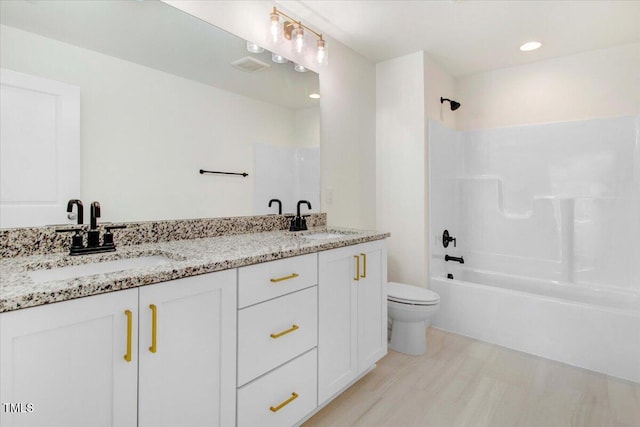 46 Otter Hole Dr, Kenly, NC 27542 - bathroom with a sink, toilet, double vanity, and tub / shower combination