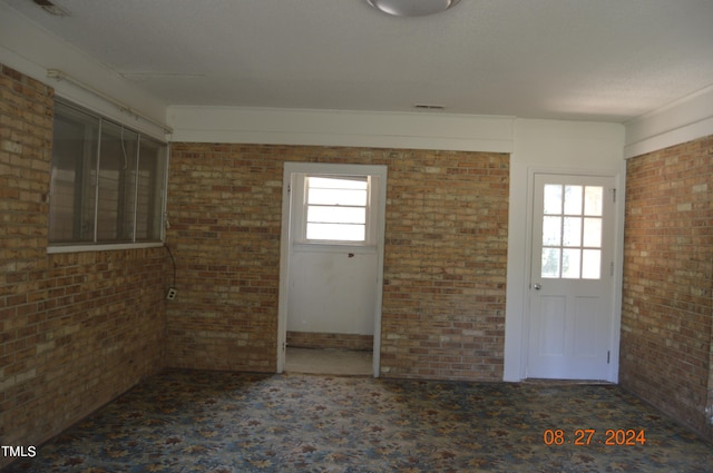 empty room with brick wall